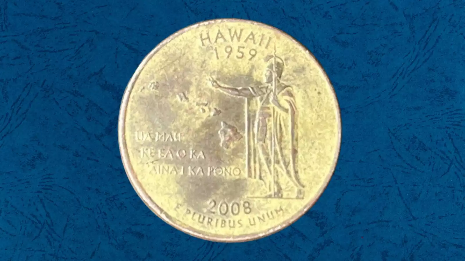 2008 quarter with missing clad layer showing copper-orange reverse side