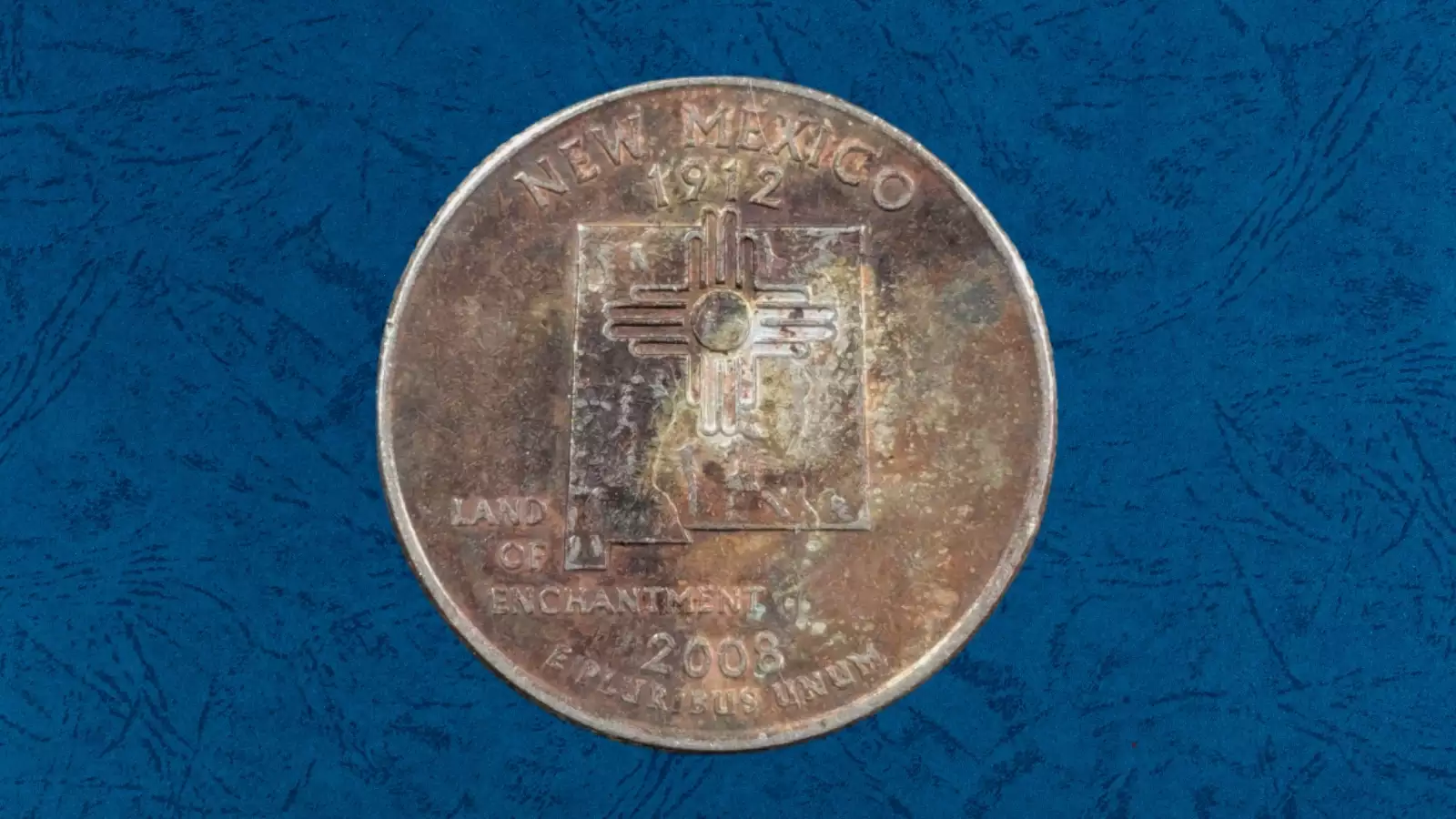2008 quarter with improperly annealed planchet error showing unusual dark discoloration on surface